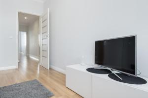 Televízia a/alebo spoločenská miestnosť v ubytovaní Elite Apartments Marine Suite