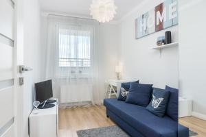 Televízia a/alebo spoločenská miestnosť v ubytovaní Elite Apartments Marine Suite