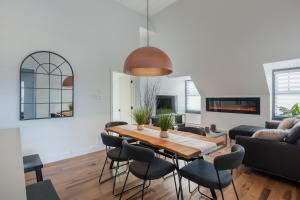 a living room with a table and chairs at Les Lofts Ste-Anne in Quebec City