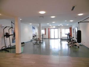 a gym with treadmills and exercise bikes in a room at Jugendherberge Tamsweg in Tamsweg