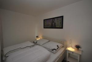 Un pat sau paturi într-o cameră la FeWo Altenau