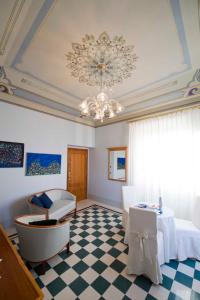 a room with a bed and a chandelier at Modà Antica Dimora in San Marino