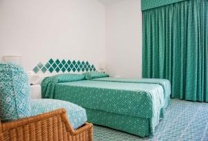 Postel nebo postele na pokoji v ubytování Hotel Torre Oliva