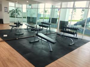 a gym with rows of chairs and a black rug at Pinnacle Tower Apartment Stay by Feel Suites in Johor Bahru