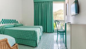 Postel nebo postele na pokoji v ubytování Hotel Torre Oliva