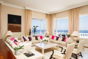 a living room with a couch and a table at Villa Mila in Puerto Calero