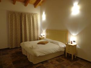 Postel nebo postele na pokoji v ubytování Agriturismo Le Case Di Campagna
