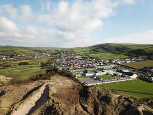 an aerial view of a town in the hills at Croyde Bay Hotel or Self Catering in Croyde