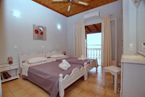 A bed or beds in a room at Baracunda Apartments