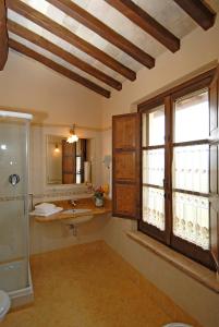 a bathroom with a sink and a window at Genius Loci Country Inn in Bevagna