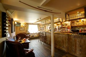 A restaurant or other place to eat at The Woolpack Inn