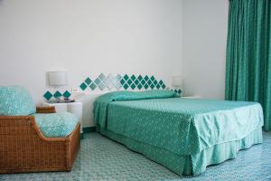 Postel nebo postele na pokoji v ubytování Hotel Torre Oliva