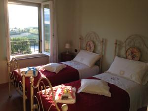 A bed or beds in a room at La terrazza fio...Rita