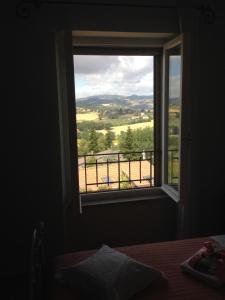 A bed or beds in a room at La terrazza fio...Rita