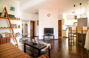 a living room with a couch and a table at Art-House in Uzhhorod