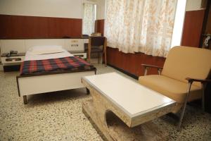 Postel nebo postele na pokoji v ubytování Hotel Srilakshmi