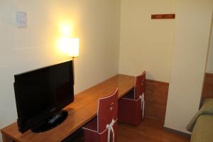 TV a/nebo společenská místnost v ubytování Hotel Flora Parc
