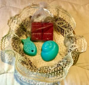 a pair of blue cookies and a red present at Apartamento Porto Beiramar in Fernando de Noronha