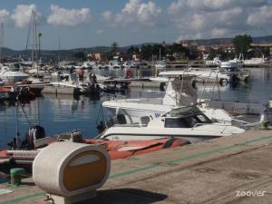 a bunch of boats are docked in a marina at Appartamento-La Caletta in La Caletta