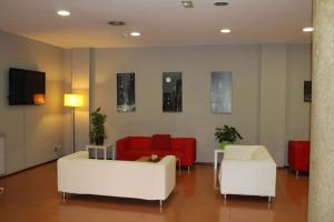 TV a/nebo společenská místnost v ubytování Hotel Flora Parc