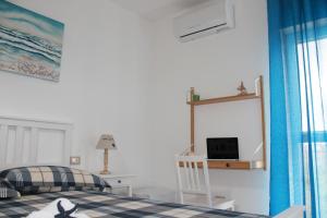 TV a/nebo společenská místnost v ubytování "A Livanti" B&B