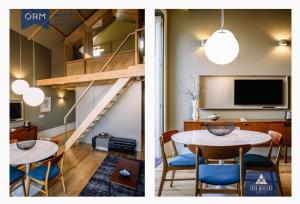 uma sala de estar e de jantar com uma mesa e uma televisão em ORM - Almada Terrace Apartment no Porto