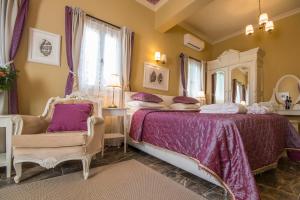 a bedroom with a bed and a large mirror at Symi Nautilus Luxury Suites in Symi