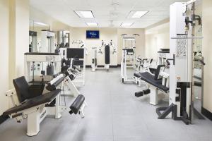 a gym with several treadmills and machines at Peabody Memphis in Memphis