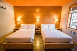 Voodi või voodid majutusasutuse Adventure Hotel toas
