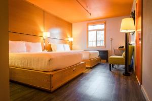 Voodi või voodid majutusasutuse Adventure Hotel toas