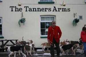 a man standing in front of a group of dogs at The Tanners Arms in Devynock