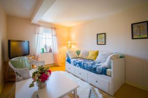 Postel nebo postele na pokoji v ubytování Apartmán U Mluvících Kamenů