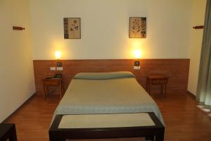 Postel nebo postele na pokoji v ubytování Hotel Flora Parc