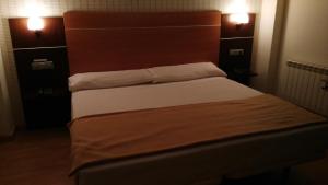 Postel nebo postele na pokoji v ubytování Hotel Alfageme