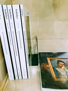 three books sitting next to each other on a shelf at The Percy's Luxury in Oxford
