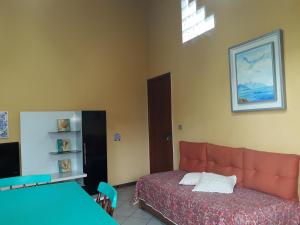 Ένα ή περισσότερα κρεβάτια σε δωμάτιο στο Apto. 3B Lagoa