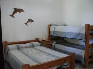 a room with two bunk beds in a house at La Nona in Villa Cura Brochero