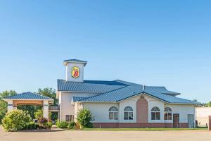 a building with a clock tower on top of it at Super 8 by Wyndham Martinsville in Martinsville