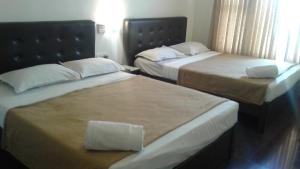 Postel nebo postele na pokoji v ubytování Rio Grande Residency