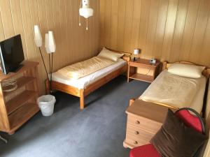 Säng eller sängar i ett rum på Drei Linden Harz