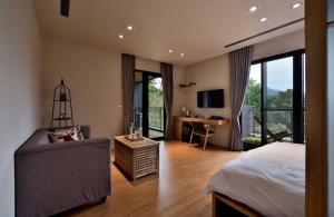 TV a/nebo společenská místnost v ubytování Shan Yi Fang Resort