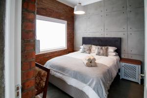 Katil atau katil-katil dalam bilik di Rustic Retreat Apartment in Durbanville
