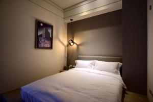 Postel nebo postele na pokoji v ubytování Sakagami Hotel