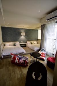 Postel nebo postele na pokoji v ubytování Sakagami Hotel