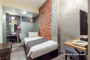 Postel nebo postele na pokoji v ubytování Ceria Hotel