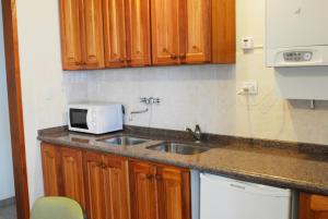 Ett kök eller pentry på Nuna Ayni Apartments