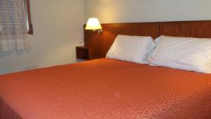Säng eller sängar i ett rum på Nuna Ayni Apartments