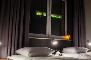Postel nebo postele na pokoji v ubytování Vulcan Hotel