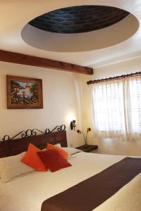 Postel nebo postele na pokoji v ubytování Hotel Posada Real Tapalpa