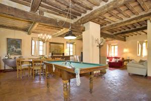 a living room with a pool table in it at Villa Bottino in San Martino in Freddana